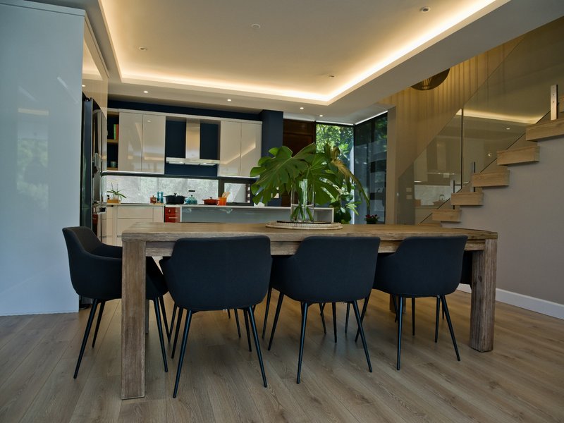 Trend-Oak-DBN-Travis-3 installed on a warm dinning room, kitchen and stairs